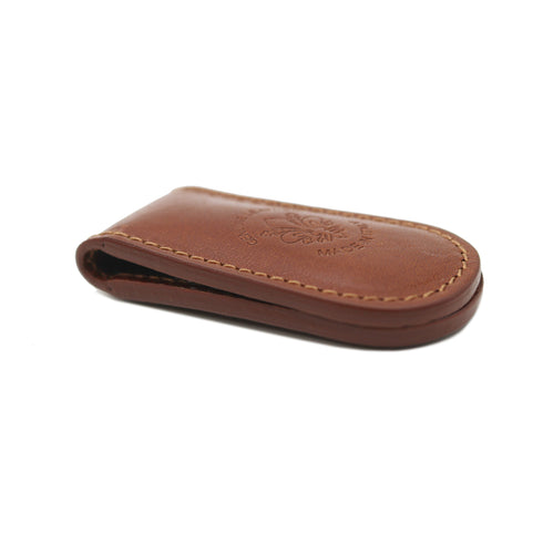 Brown leather money clip on a white background